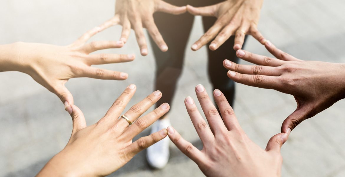 Hands of three women