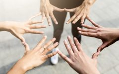 Hands of three women